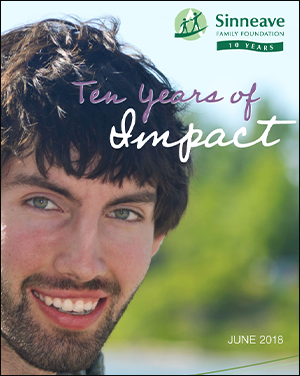 On a graphic background, is the logo of The Sinneave Family Foundation in green and white. Below it, the text reads, "Ten Years of Impact". This is the cover image of the Ten Year Impact Report.
